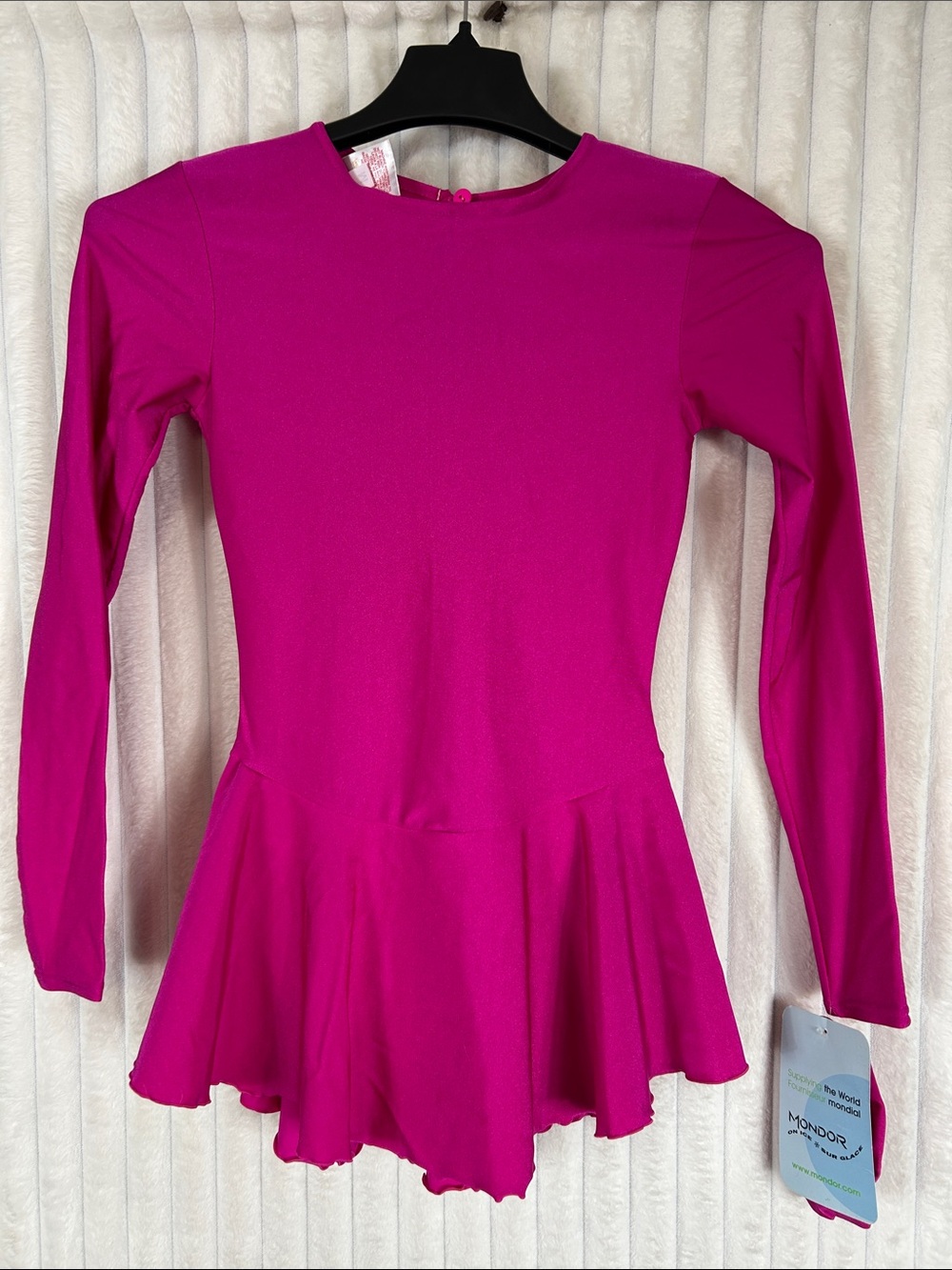 Mondor figure skating dress is a vibrant fuchsia pink with long sleeves girls M